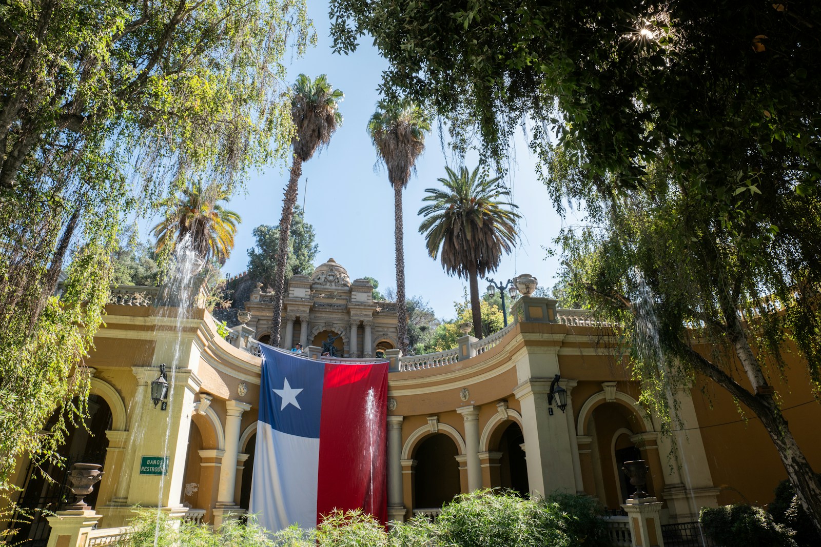 a large texas state flag hanging from the side of a building